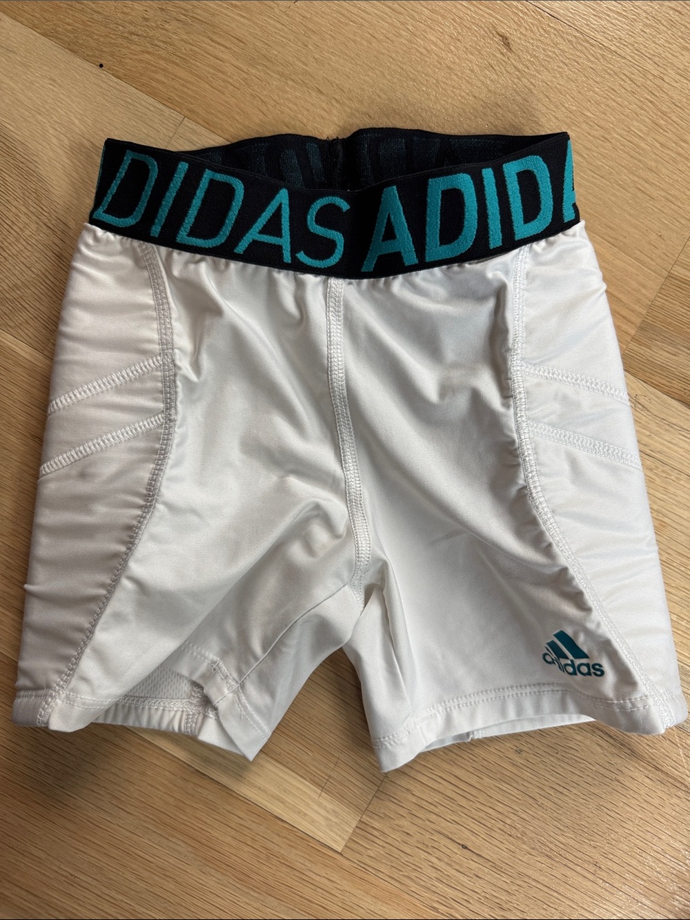 adidas White sliding softball Shorts with Black Waistband and Teal Logo
